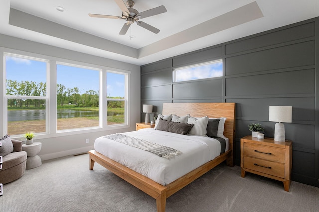 9156 Perry Ct Lot C, Lot C, Zeeland, MI 49464 - bedroom with light carpet, a water view, and a ceiling fan
