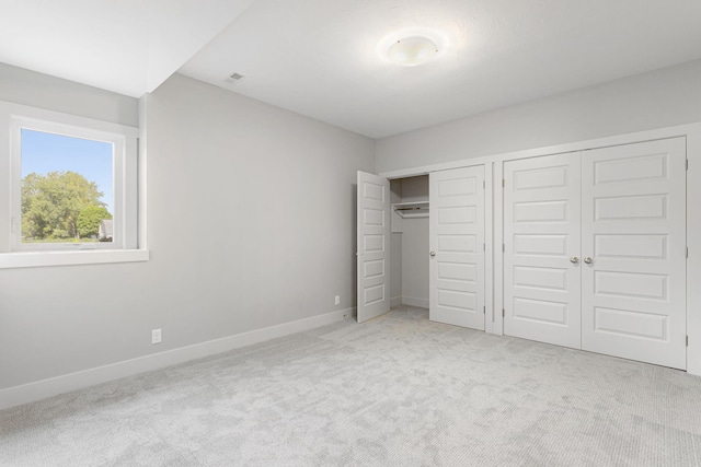 9156 Perry Ct Lot C, Lot C, Zeeland, MI 49464 - unfurnished bedroom with carpet flooring, multiple closets, and baseboards