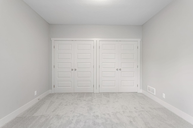 9156 Perry Ct Lot C, Lot C, Zeeland, MI 49464 - unfurnished bedroom featuring carpet, a closet, and baseboards