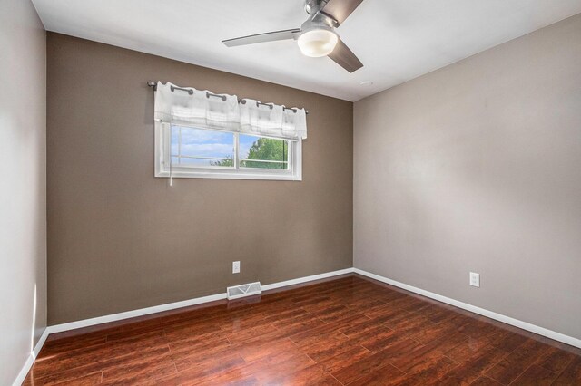 1433 Kingman Dr, Saint Joseph, MI 49085 - spare room with ceiling fan, dark wood-style flooring, and baseboards