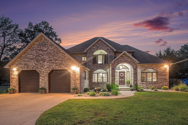 1256 Barron Lake Rd, Niles, MI 49120 - french country inspired facade with driveway, a front yard, brick siding, a garage, and a shingled roof