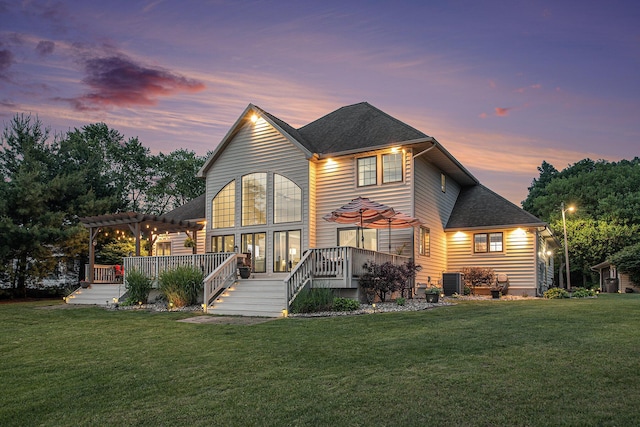 1256 Barron Lake Rd, Niles, MI 49120 - rear view of house featuring a pergola, a wooden deck, and a lawn