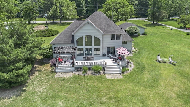 1256 Barron Lake Rd, Niles, MI 49120 - back of house featuring a deck, a shingled roof, and a yard
