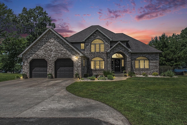 1256 Barron Lake Rd, Niles, MI 49120 - french country style house featuring a front lawn, an attached garage, concrete driveway, and roof with shingles