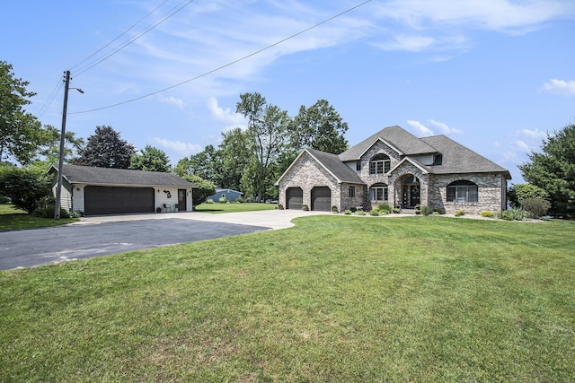 1256 Barron Lake Rd, Niles, MI 49120 - french country style house with stone siding, driveway, a garage, and a front yard