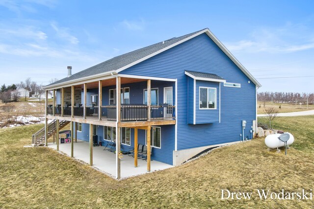 4688 20 Mile Rd, Kent City, MI 49330 - back of property featuring a patio, a lawn, stairs, and a shingled roof