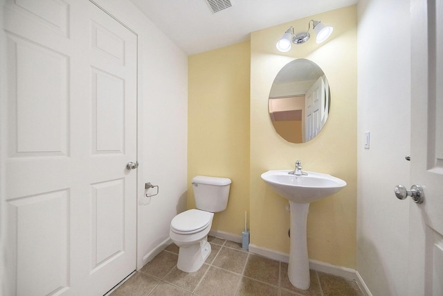 3197 Asher Rd, Ann Arbor, MI 48104 - bathroom featuring tile patterned flooring, toilet, and baseboards