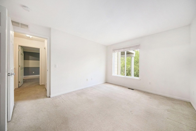 3197 Asher Rd, Ann Arbor, MI 48104 - unfurnished room featuring light colored carpet, baseboards, and a smoke detector