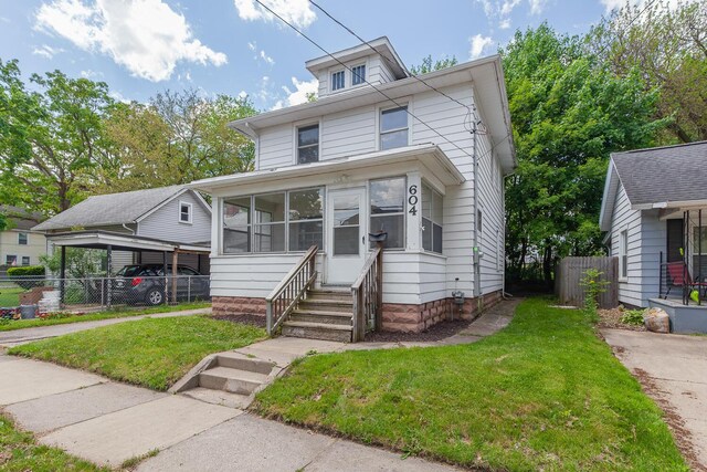 604 Edgewood St, Jackson, MI 49202 - traditional style home featuring a sunroom and entry steps