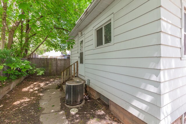 604 Edgewood St, Jackson, MI 49202 - view of home's exterior featuring cooling unit and fence
