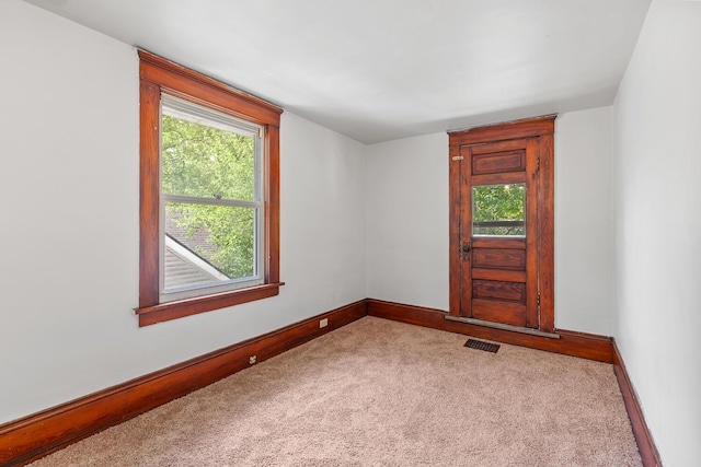 604 Edgewood St, Jackson, MI 49202 - carpeted spare room with baseboards and healthy amount of natural light