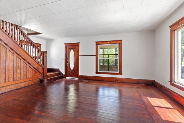 604 Edgewood St, Jackson, MI 49202 - entryway with healthy amount of natural light, stairs, wood finished floors, and baseboards