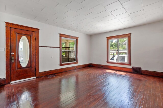 604 Edgewood St, Jackson, MI 49202 - entrance foyer with plenty of natural light, hardwood / wood-style floors, and baseboards