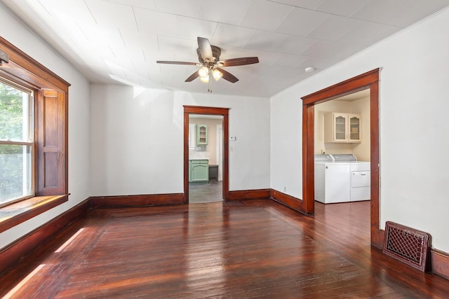 604 Edgewood St, Jackson, MI 49202 - empty room featuring independent washer and dryer, dark wood-style flooring, baseboards, and ceiling fan