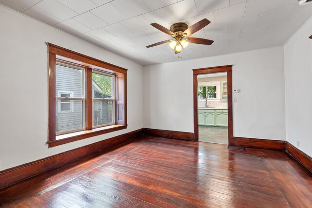 604 Edgewood St, Jackson, MI 49202 - unfurnished room featuring hardwood / wood-style floors, baseboards, a ceiling fan, and a sink