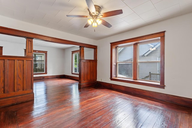 604 Edgewood St, Jackson, MI 49202 - unfurnished room with dark wood-style flooring, a ceiling fan, and baseboards