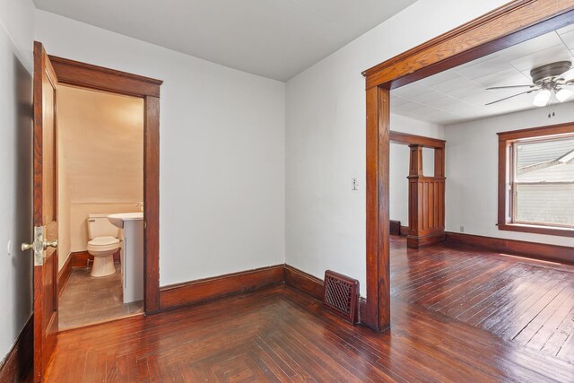 604 Edgewood St, Jackson, MI 49202 - empty room with a ceiling fan, baseboards, and parquet floors