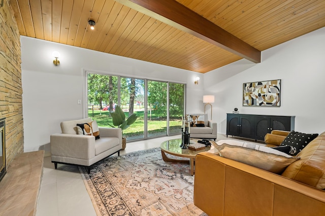 520 N W St, Coloma, MI 49038 - living room with light tile patterned flooring, wood ceiling, beamed ceiling, and a stone fireplace