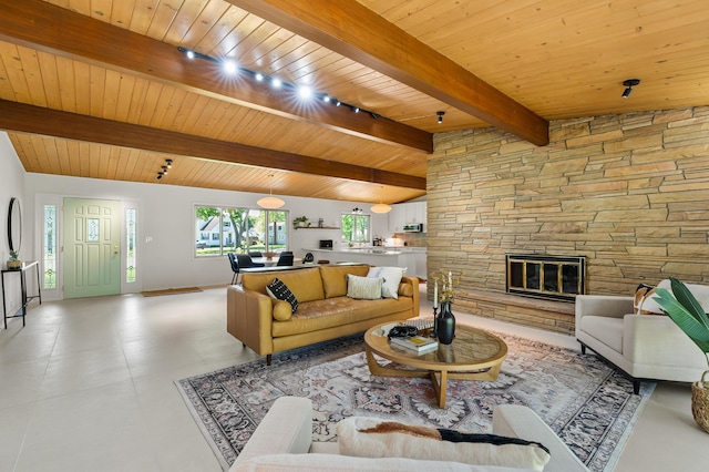 520 N W St, Coloma, MI 49038 - living room featuring wooden ceiling, track lighting, a fireplace, and baseboards
