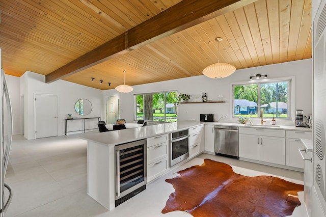 520 N W St, Coloma, MI 49038 - kitchen with stainless steel appliances, beverage cooler, a sink, wooden ceiling, and open shelves