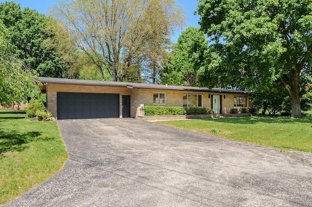520 N W St, Coloma, MI 49038 - ranch-style home featuring an attached garage, driveway, and a front lawn