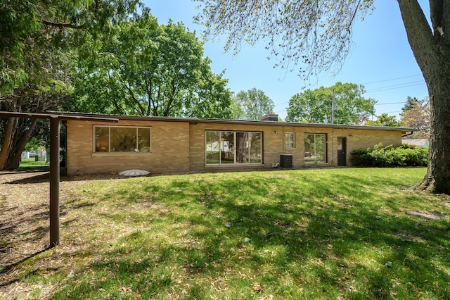520 N W St, Coloma, MI 49038 - view of front facade with a front lawn, a chimney, and central air condition unit