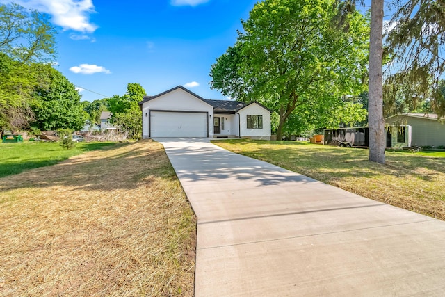611 River Rd, Marshall, MI 49068 - view of front of home featuring driveway, a front yard, and a garage