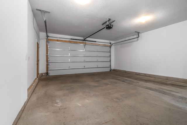 611 River Rd, Marshall, MI 49068 - garage featuring a garage door opener
