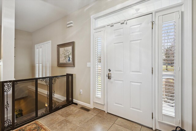 1259 Rose Dr, Niles, MI 49120 - entryway featuring baseboards and light tile patterned flooring