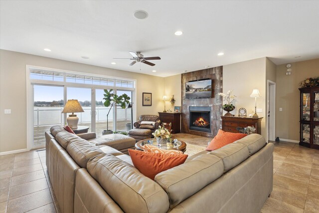 1259 Rose Dr, Niles, MI 49120 - living room featuring a tiled fireplace, recessed lighting, baseboards, a ceiling fan, and light tile patterned flooring
