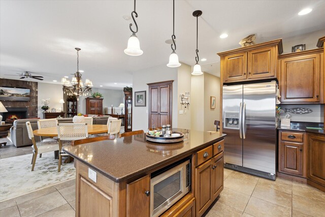 1259 Rose Dr, Niles, MI 49120 - kitchen with appliances with stainless steel finishes, open floor plan, a large fireplace, ceiling fan, and recessed lighting