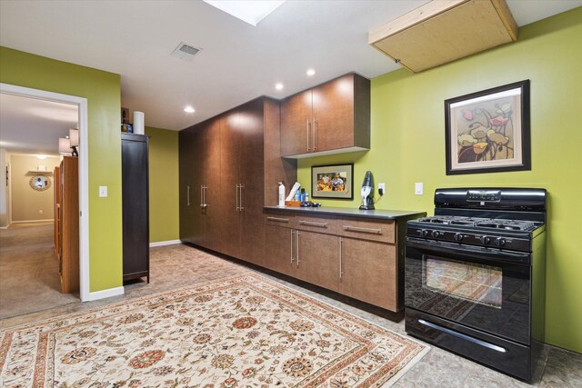 1259 Rose Dr, Niles, MI 49120 - kitchen featuring black gas range oven, dark countertops, baseboards, and recessed lighting