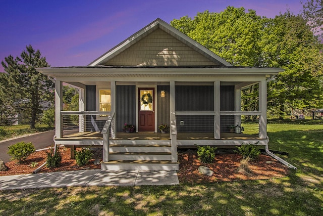 3401 Hicks Ave, Benton Harbor, MI 49022 - bungalow-style house with a front lawn and a porch