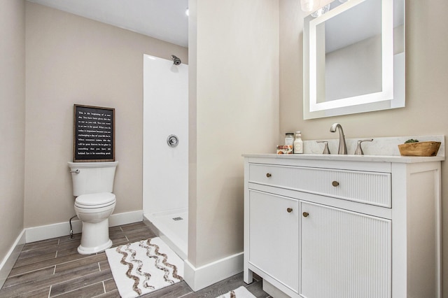 3401 Hicks Ave, Benton Harbor, MI 49022 - bathroom featuring toilet, a stall shower, baseboards, and wood finished floors