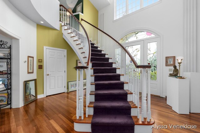 404 N Shore Dr, South Haven, MI 49090 - stairway with a high ceiling, wood finished floors, and baseboards