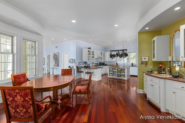 404 N Shore Dr, South Haven, MI 49090 - dining room with dark wood-style flooring, ornamental molding, and recessed lighting