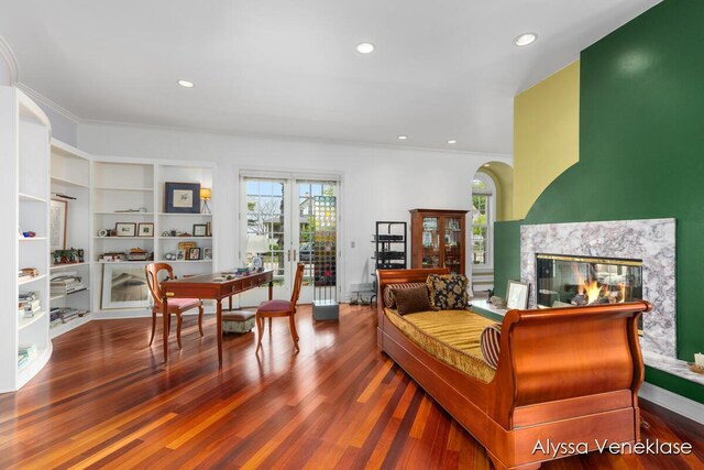 404 N Shore Dr, South Haven, MI 49090 - living room featuring a multi sided fireplace, wood finished floors, crown molding, french doors, and recessed lighting