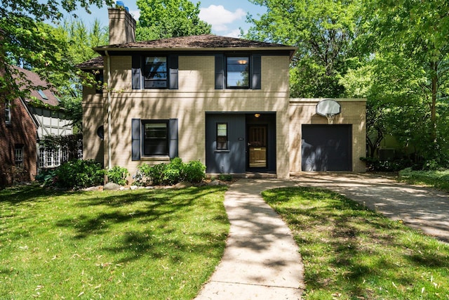 1711 Morton Ave, Ann Arbor, MI 48104 - view of front of house with driveway, a garage, a chimney, a front lawn, and brick siding