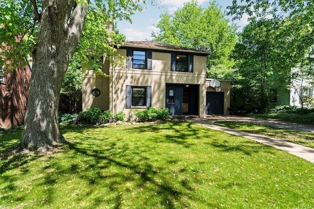 1711 Morton Ave, Ann Arbor, MI 48104 - view of front of house featuring a front yard, a chimney, an attached garage, and brick siding