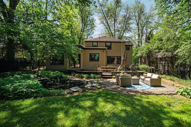 1711 Morton Ave, Ann Arbor, MI 48104 - rear view of property with an outdoor living space, a patio area, and stucco siding