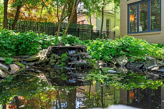 1711 Morton Ave, Ann Arbor, MI 48104 - exterior view of brick siding and a small pond