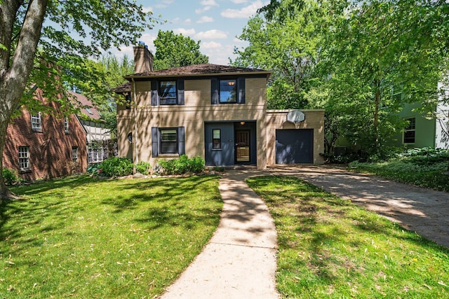 1711 Morton Ave, Ann Arbor, MI 48104 - view of front of home featuring driveway, a chimney, a garage, a front yard, and brick siding