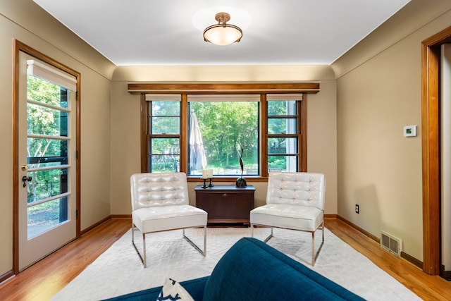 1711 Morton Ave, Ann Arbor, MI 48104 - sitting room featuring plenty of natural light and wood finished floors