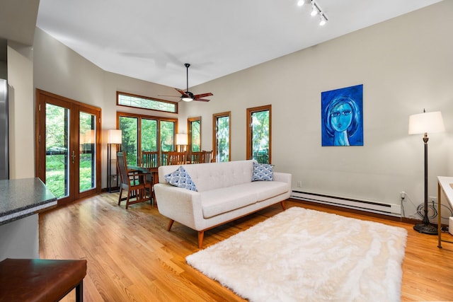 1711 Morton Ave, Ann Arbor, MI 48104 - living room featuring a baseboard heating unit, light wood-type flooring, ceiling fan, and track lighting