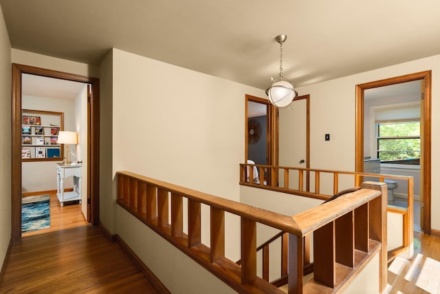 1711 Morton Ave, Ann Arbor, MI 48104 - hallway with wood finished floors and an upstairs landing