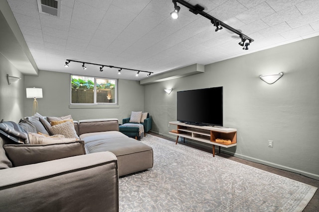 1711 Morton Ave, Ann Arbor, MI 48104 - carpeted living room with rail lighting and baseboards