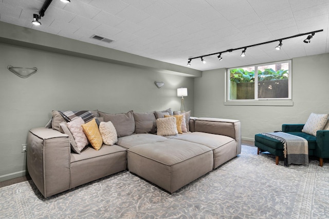 1711 Morton Ave, Ann Arbor, MI 48104 - carpeted living room featuring track lighting and baseboards
