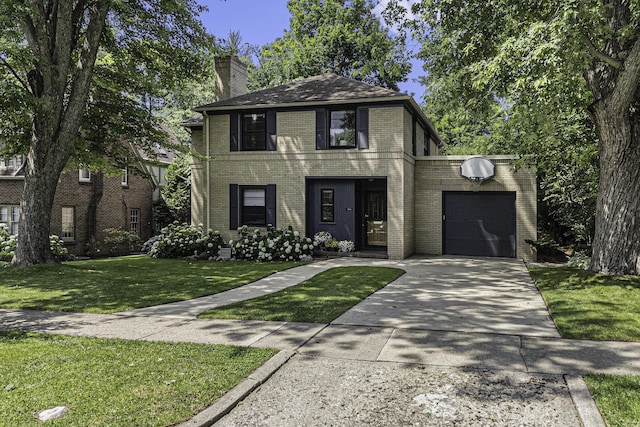 1711 Morton Ave, Ann Arbor, MI 48104 - traditional style home featuring driveway, a garage, brick siding, a front lawn, and a chimney