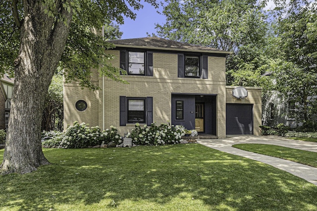 1711 Morton Ave, Ann Arbor, MI 48104 - view of front of house with driveway, brick siding, a front lawn, and a garage