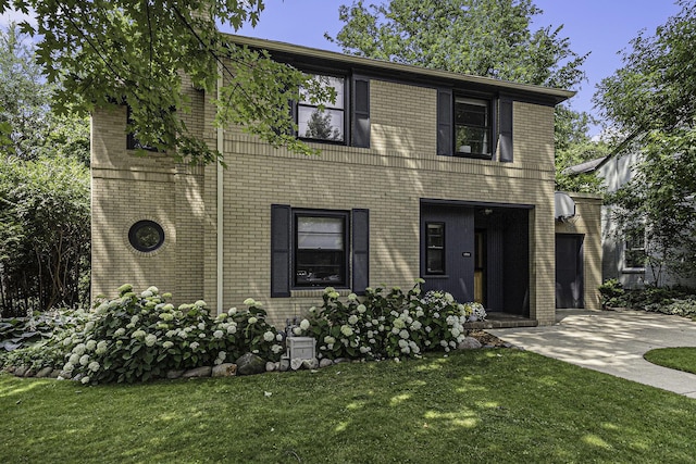 1711 Morton Ave, Ann Arbor, MI 48104 - view of front of house featuring a front yard and brick siding